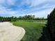 A manicured backyard features lush green grass and decorative landscaping around the fence at 5379 Marigold Dr, Plainfield, IN 46168