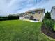 A large, grassy backyard features a patio and lawn at 5379 Marigold Dr, Plainfield, IN 46168
