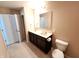 Bathroom featuring a double sink vanity with tile floors and toilet with a closed door at 5379 Marigold Dr, Plainfield, IN 46168