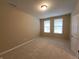 Neutral bedroom offering natural light and a blank canvas to create your own personal retreat at 5379 Marigold Dr, Plainfield, IN 46168