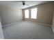 Spacious bedroom featuring two windows and neutral carpet at 5379 Marigold Dr, Plainfield, IN 46168