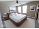 Bedroom featuring a large bed, windows, side tables, and modern lighting at 5379 Marigold Dr, Plainfield, IN 46168