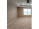 Neutral bedroom with a ceiling fan, one window letting in plenty of natural light at 5379 Marigold Dr, Plainfield, IN 46168