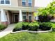 Inviting front porch with brick accents and manicured landscaping creates a welcoming entrance at 5379 Marigold Dr, Plainfield, IN 46168