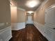 Long foyer with wood flooring, wainscoting, and ample lighting welcomes you inside this home at 5379 Marigold Dr, Plainfield, IN 46168