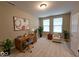 Bright home office featuring neutral walls, large windows, and ample space for a productive work environment at 5379 Marigold Dr, Plainfield, IN 46168