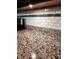 Close up of kitchen countertop featuring speckled granite and white tiled backsplash at 5379 Marigold Dr, Plainfield, IN 46168