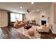 Inviting living room featuring hardwood floors, fireplace, and expansive windows for natural light at 5379 Marigold Dr, Plainfield, IN 46168