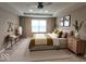 Comfortable primary bedroom with a ceiling fan, natural light, and modern decor at 5379 Marigold Dr, Plainfield, IN 46168