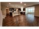 Spacious open concept living area features hardwood floors, modern kitchen and adjoining living room space at 5379 Marigold Dr, Plainfield, IN 46168