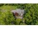 Aerial view of a charming home with a well-manicured lawn and mature trees at 5506 Kessler Blvd N Dr, Indianapolis, IN 46228