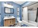 Modern bathroom features tile flooring and a shower-tub combo at 5506 Kessler Blvd N Dr, Indianapolis, IN 46228