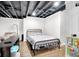 Basement bedroom features a comfortable bed at 5506 Kessler Blvd N Dr, Indianapolis, IN 46228