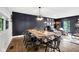 Stylish dining area open to living space, featuring elegant furniture and decor at 5506 Kessler Blvd N Dr, Indianapolis, IN 46228
