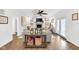Cozy living room with fireplace, ceiling fan, and plenty of natural light at 5506 Kessler Blvd N Dr, Indianapolis, IN 46228