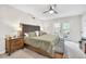 This spacious main bedroom offers soft carpet, stylish ceiling fan, and access to a private outdoor balcony at 5506 Kessler Blvd N Dr, Indianapolis, IN 46228