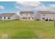 The backyard features a spacious lawn area, perfect for outdoor activities at 5768 Blue Sky Dr, Whitestown, IN 46075