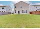 Expansive backyard featuring a lush lawn and surrounded by privacy fencing at 5768 Blue Sky Dr, Whitestown, IN 46075