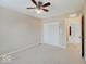 Cozy bedroom with carpet, ceiling fan, closet, and access to another room at 5768 Blue Sky Dr, Whitestown, IN 46075