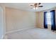 Spacious bedroom with carpet, ceiling fan, and window with curtains at 5768 Blue Sky Dr, Whitestown, IN 46075