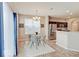 Charming dining area with stylish lighting fixture, adjacent to the modern kitchen at 5768 Blue Sky Dr, Whitestown, IN 46075