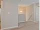 Carpeted hallway showing lighting, railings and neutral paint at 5768 Blue Sky Dr, Whitestown, IN 46075
