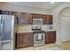 Kitchen boasting stainless steel appliances, wood cabinets, and a pantry at 5768 Blue Sky Dr, Whitestown, IN 46075