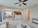Bright and airy living space open to dining area, with neutral tones and modern decor at 5768 Blue Sky Dr, Whitestown, IN 46075