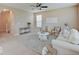 Comfortable living room showcasing neutral decor, a stylish rug, and natural light at 5768 Blue Sky Dr, Whitestown, IN 46075