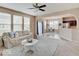Open-concept living area with seamless flow to dining space and modern kitchen at 5768 Blue Sky Dr, Whitestown, IN 46075