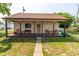 This home boasts a delightful porch perfect for outdoor seating and relaxation, with a quaint backyard space at 60 S 8Th Ave, Beech Grove, IN 46107