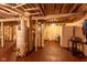 View of basement with mechanical equipment and storage space with a small table and chairs at 60 S 8Th Ave, Beech Grove, IN 46107