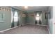 Cozy bedroom featuring fresh carpet, ceiling fan, nice paint and great natural light at 60 S 8Th Ave, Beech Grove, IN 46107