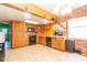Bright kitchen featuring tile floors, wooden cabinets, brick accent wall and modern appliances at 60 S 8Th Ave, Beech Grove, IN 46107