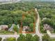 Aerial view of property highlighting lush landscaping and the home's location on a tree-lined street at 6363 Harmonridge Ct, Indianapolis, IN 46278