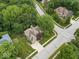 A winding neighborhood street with lovely homes nestled among mature trees at 6363 Harmonridge Ct, Indianapolis, IN 46278