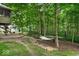 Secluded backyard featuring a hammock, mature trees, and privacy at 6363 Harmonridge Ct, Indianapolis, IN 46278