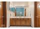 Bathroom with double vanity, tile floor, and natural wood cabinets at 6363 Harmonridge Ct, Indianapolis, IN 46278