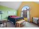 Cozy bedroom with natural lighting and an arched window at 6363 Harmonridge Ct, Indianapolis, IN 46278
