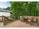Outdoor deck featuring wood flooring, wrought iron railing, and natural views at 6363 Harmonridge Ct, Indianapolis, IN 46278
