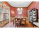 Dining room features hardwood floors, a chandelier and decorative trim at 6363 Harmonridge Ct, Indianapolis, IN 46278
