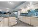 Well lit kitchen with custom backsplash, tile floors, and granite countertops with seating at 6363 Harmonridge Ct, Indianapolis, IN 46278