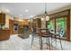 Well-lit kitchen features an island, stainless steel appliances, and adjacent eating area at 6363 Harmonridge Ct, Indianapolis, IN 46278