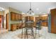 Bright kitchen area with large island, stainless appliances, and eat-in dining area at 6363 Harmonridge Ct, Indianapolis, IN 46278