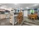 Open concept kitchen with a breakfast bar and seating, tile flooring and ample cabinet space at 6363 Harmonridge Ct, Indianapolis, IN 46278