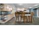Long kitchen bar with seating. Perfect for entertaining and watching sports at 6363 Harmonridge Ct, Indianapolis, IN 46278