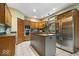 Spacious kitchen with stainless steel appliances, center island, and ample counter space at 6363 Harmonridge Ct, Indianapolis, IN 46278