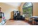 Home office with hardwood floors, large window, and built-in desk and storage at 6363 Harmonridge Ct, Indianapolis, IN 46278