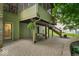 Under-deck patio featuring brick pavers, swing, and outdoor access at 6363 Harmonridge Ct, Indianapolis, IN 46278