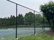 Well-maintained tennis court with a secure fence, offering a great recreational amenity at 6363 Harmonridge Ct, Indianapolis, IN 46278